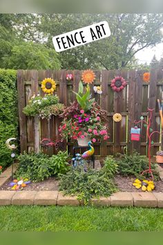 a fence with flowers and gardening tools in it