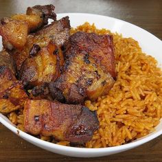 a white bowl filled with meat and rice