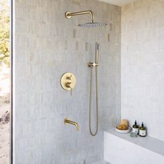 a bathroom with a walk in shower next to a window