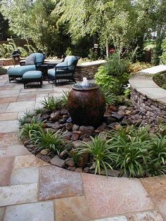 an outdoor patio area with seating and landscaping