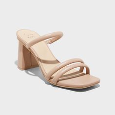 Upgrade your footwear with these Stacy Mule Heels from A New Day™. These slip-on sandals are sure to win you over with their modern open D-toe, 2-strap vamp and slender instep strap. With a breezy backless silhouette and cushioned insole, the medium-width sandals are set on a three-inch flared block heel for a statement lift in your height, whether you choose to dress them up or down. A New Day™: Style that goes wherever you do. Nude Shoes Block Heel, Womens Block Heels, Nude Bridesmaid Shoes, Pref Dresses, Bridesmaids Heels, Strappy Mules, Rush Outfits, Mule Heels, Nude Sandals