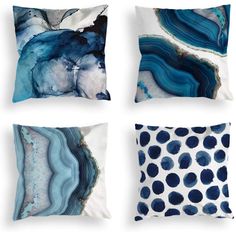 four pillows with blue and white designs on them