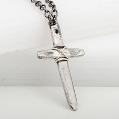 This Medieval Cross Wired Pendant Necklace is perfect for any occasion. Made from 925 sterling silver, it's hand-hammered and wound with silver wire for a beautiful, patina-inspired rustic look. Great for Father's Day, First Communion, or Confirmation, this necklace is the perfect gift to share the bond of love and faith between father and son. Antique Silver Medieval Jewelry With Oxidized Finish, Medieval Jewelry In Antique Silver With Oxidized Finish, Hand Forged Silver Medieval Jewelry, Hand Forged Medieval Silver Jewelry, Medieval Sterling Silver Necklace In Silver, Antique Silver Hand Forged Sterling Silver Necklaces, Hand Forged Antique Silver Sterling Necklace, Hand Forged Sterling Silver Necklace In Antique Silver, Medieval Silver Cross Pendant Jewelry