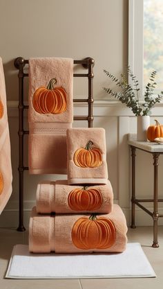 towels with pumpkins are stacked on top of each other