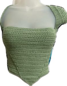 a crocheted top on a mannequin head