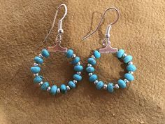 Authentic Beautiful Navajo Zuni oversized hoop earrings with Sleeping Beauty Turquoise and Silver balls.  Handcrafted by Navajo Artist Harriet Crosby Great for a Gift ❤️ Earrings are 1.0" Hoop Earrings are SO popular right now.. These are perfect for Hoop Lovers! They are large enough to be seen from a far. Perfect hoops to go with Jeans and Boots! Southwestern Turquoise Nickel-free Hoop Earrings, Handmade Southwestern Turquoise Hoop Earrings, Turquoise Southwestern Nickel-free Hoop Earrings, Southwestern Turquoise Hoop Earrings Nickel Free, Nickel-free Southwestern Style Round Hoop Earrings, Oversized Hoop Earrings, Navajo Earrings, Southwestern Jewelry, Sleeping Beauty Turquoise