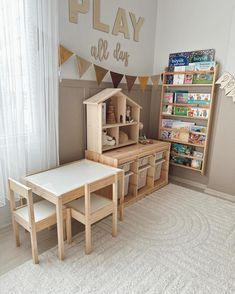 a play room with wooden toys and bookshelves