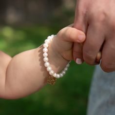 Our favorite classic pearls styled for Mommy & Me. How sweet to dress up with matching bracelets knowing they represent your special love for each other. Bracelets are created with 6mm freshwater pearls and 14k gold filled accent bead. Mommy heart is hand hammered and approximately 1" across. Mini styles have a smaller sized heart approsimately 1/2" across. Easy wear and effortless bracelet stacking with stretch cord design. Bracelet is made to fit an average 7" wrist for mommy. Select your choi Elegant Personalized Pearl Bracelet For Everyday, Elegant Everyday Personalized Pearl Bracelet, Personalized Adjustable Classic Pearl Bracelet, Elegant Adjustable Hypoallergenic Heart Bracelet, Elegant Charm Bracelet With Pearl And Round Beads, Classic Personalized Adjustable Pearl Bracelet, Elegant Hypoallergenic Adjustable Heart Bracelet, Classic Adjustable Personalized Pearl Bracelet, Classic Adjustable Hypoallergenic Pearl Bracelet