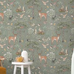 an animal themed wallpaper with deers and trees