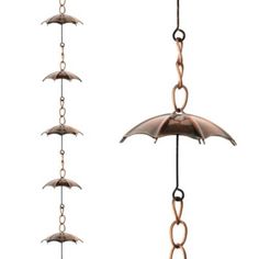 an umbrella hanging from chains on a white background