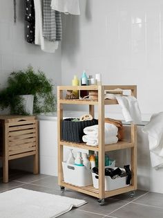 a wooden shelf filled with lots of bathroom items