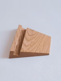 a piece of wood sitting on top of a white surface