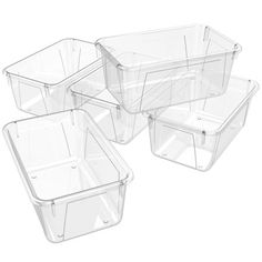 four clear plastic containers with lids