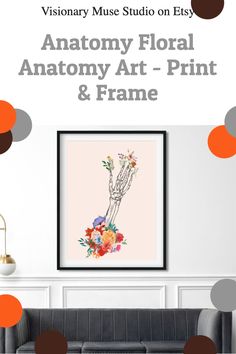 an art print is hanging on the wall above a gray couch with orange circles around it