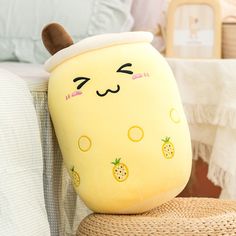 a yellow stuffed animal sitting on top of a chair