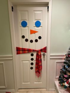 Ready to hang snowman. Everything you need to turn your door into a statement piece.  The pieces are laminated to last for years.  Great gift for adults or kids. Easy to store away at the end of the season.  Kit includes sticky tack to hang, paper eyes, nose, mouth, and buttons all laminated, red buffalo plaid fabric scarf and a sample picture to make for an easy build.  It is recommended to be hung on an inside white door. It can be used outside, however you might want to hang the pieces with s Door Snowman Decoration, Snowman Door Decor, Door Decorations For Christmas Contest, Snowman Door Decoration For Classroom, Inside Door Decorations, Christmas Door Decorations For School, Snowman Door Decoration, Childrens Ministry Room, Paper Eyes