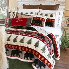 a bed with bear and pine trees on it