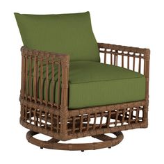 a wicker chair with green cushions on an isolated white background for use in furniture design