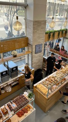 people are standing in line at the bakery