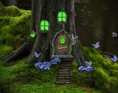 an image of a fairy tree house in the woods with blue flowers and butterflies around it