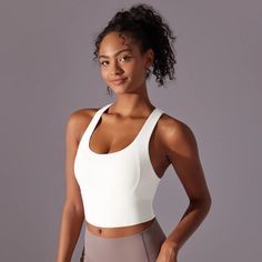 Introducing the Electra Active Top - the perfect addition to your workout wardrobe. With a sleek cross-back straps for added support and a mid length design, this top provides both style and function. Available in a variety of vibrant colors to elevate your workout wardrobe Product Details: Nylon Crossback Straps Mid Length Padded cups Imported White Fitted Activewear With Built-in Bra, White Activewear With Built-in Bra For Training, White Yoga Activewear With Built-in Bra, White Sports Bra With Built-in Bra And Cross Back, White Sportswear Activewear With Built-in Bra, Summer Activewear, Sports Bra Top, Blue Bra, Bra Size Guide