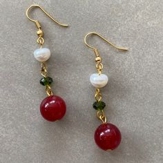 Holiday Earrings! This design earrings are made of green agate, pearls and red agate stones.  When people think of the colors red and green, one thing comes to mind: Christmas.  Red has long been a powerful color associated with fire, spiritual awakening, and the blood of Jesus Christ, whose birthday is celebrated on December 25.  Green often symbolizes money, good luck, and health through the holidays and into the new year. ☆ Those looking for earrings of different designs for the new year can Red Agate Earrings For Gift, Red Agate Earrings As Gift, Red Agate Dangle Earrings, Red Agate Earrings With Natural Stones, Red Pearl Dangle Jewelry, Red Round Pearl Drop Earrings, Red Pearl Drop Round Earrings, Beaded Jade Earrings As A Gift, Handmade Red Pearl Earrings