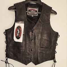 Brand New! Women's Ladies River Road Black Leather Vest. Has Inner Pocket On The Left. Gun Pocket On The Right. Two Front Pockets. Side Leather Lacing Can Be Tightened Or Loosened For Extra Comfort. Acl Fits, Vintage Leather Vest, Leather Biker Vest, Leather Lacing, Cowboy Costume, Black Leather Vest, Motorcycle Vest, River Road, Leather Jacket Style