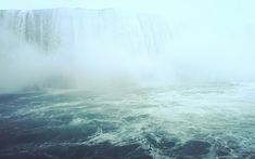 the niagara falls are surrounded by mist and water