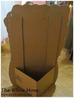 an open cardboard box sitting on the floor