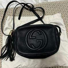 Pre-Owned Gucci Soho Disco Bag In Black With Gold Hardware. Inside In Good Condition With A Few Light Stains. Outside Overall Still In Good Condition. The Corners Of Bag In Front Very Worn But Hard To Tell From Far Away. Great Crossbody. Perfect For Everyday Or A Night Out. Can Fit Alot! Black Gucci Bag With Logo, Gucci Evening Bags With Logo, Black Gucci Shoulder Bag With Logo, Gucci Soho Disco Bag, Soho Disco Bag, Gucci Soho, Gucci Soho Disco, Bags Gucci, Light Stain