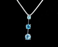 "Vintage Sterling Silver Blue CZ Cubic Zirconia Gemstone Tiered Pendant Necklace 18\" Item offered is a vintage sterling blue CZ pendant necklace. This necklace consists of 3 cubic zirconia stones in a simple vertical setting. Clasp is a spring clasp and is marked \"925\". Pendant is marked \"925\" Condition: Excellent; item is pre-owned and may have some signs of light use. Please look closely at the pictures provided as they are an extension of our written description. Measurements: Necklace l Blue Stone Necklaces For Anniversary, Elegant Blue Crystal Sterling Silver Necklace, Blue Gemstone Jewelry With Rectangular Pendant, Sapphire Color Cubic Zirconia Pendant Necklace, Blue Tarnish-resistant Pendant Jewelry, Blue Gemstone Square Pendant Necklace, Cz Jewelry, Sterling Jewelry, Cz Pendant