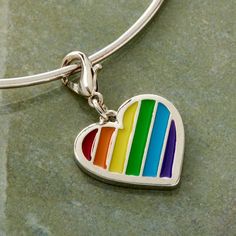 "Buy the Charmalong™ Rainbow Heart Charm by Bead Landing™ at Michaels. This lovely rainbow heart charm by Bead Landing will be perfect to make a personalized jewelry design. This lovely rainbow heart charm by Bead Landing will be perfect to make a personalized jewelry design. You can place it on your charm bracelet with other matching charms for a fun and unique accessory. Details: Multicolor 1.5\" x 1.5\" x 0.25\" (38.1mm x 38.1mm x 6.3mm) Zinc alloy, iron and epoxy | Charmalong™ Rainbow Heart Multicolor Heart-shaped Jewelry For Friendship, Multicolor Heart Jewelry For Friendship, Everyday Multicolor Jewelry With Heart Charm, Personalized Rainbow Heart Jewelry, Personalized Heart-shaped Rainbow Jewelry, Sterling Silver Multicolor Jewelry With Heart Charm, Gift Rainbow Jewelry With Heart Beads, Rainbow Heart Beads Jewelry Gift, Rainbow Heart Beads Jewelry For Gift