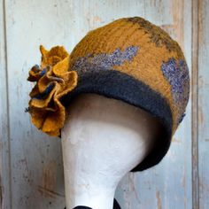 "A handmade stylish retro vintage style, slouchy felt beanie, a felted wool hat, to keep you warm and stylish this Fall/Winter time. It is made with mustard and black merino wool and a beautiful pure wool  vintage style fabric . To make this hat I have used the nuno-felting\" technique (felt and fabric). It is Made with pure merino wool, and  fabric.  merino wool fibers are spread thinly upon a fabric. The result is a light, soft and warm Hat.  To finish the look of this beanie I made a matching Vintage Brimmed Felt Hat For Winter, Handmade Wool Hats One Size Fits Most, Winter Fitted Bohemian Felt Hat, Handmade Wool Hat One Size, Retro Adjustable Felt Hat For Winter, Handmade Winter Felt Hat In One Size, Handmade Fitted Mini Hats For Winter, Handmade Wool Felt Hat For Winter, Handmade Cloche Hat For Winter