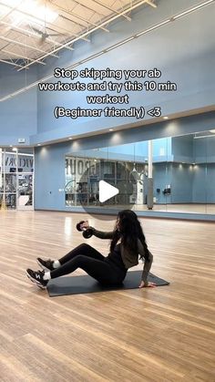 a woman sitting on top of a yoga mat in an empty room with the words, stop skipping your abs workout and try this 10 min