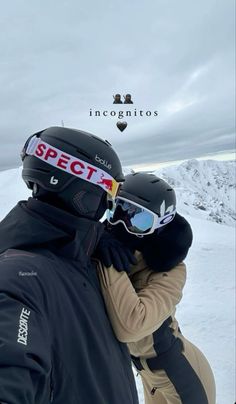 two people in ski gear hugging each other