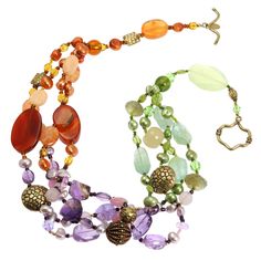 The Prehnite Amethyst Carnelian Necklace adds an artistic touch to your jewelry collection. Its vibrant strands of color instantly brighten solid tops and dresses or add a pop of interest when layered. Handmade in the USA, the necklace features a mix of smooth and faceted amethyst, carnelian and prehnite gemstone beads. Complementary purple, orange and green hues create a lively tropical look. Prehnite Amethyst Carnelian Necklace - Vibrant Gemstone Strands Brighten Any Outfit Add an instant pop Multicolor Carnelian Gemstone Beaded Necklaces, Multicolor Carnelian Jewelry With Polished Beads, Multicolor Carnelian Beaded Jewelry, Multicolor Amethyst Bohemian Necklace, Unique Multi-stone Round Bead Necklaces, Bohemian Multicolor Amethyst Necklaces, Artisan Multicolor Carnelian Necklace, Bohemian Multicolor Amethyst Necklace, Multicolor Amethyst Gemstone Beaded Necklaces