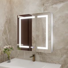 a bathroom with a sink, mirror and flowers in the vase on the counter top