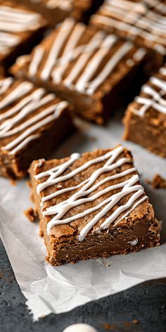 some brownies with white icing on top of them