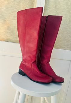 Vintage Y2K hot pink riding boots with flat heels.  Women's size 7.5 with wider width legs.  They measure 16" high, 10" long and have a 1.75" flat heel.  In good vintage condition. Shipping: USPS Standard Post (insurance tracking included) We are happy to ship internationally! *Due to the variability in shipping costs based on location, anything in excess of $2.00 over the actual cost will be refunded.  We can provide a combined shipping cost and/or estimate to your location. Refunds and Exchanges: All sales are final.  You will not be refunded if an item does not fit. Please check the measurements carefully and ZOOM into photographs to view details.  Please ask any questions prior to purchase.  Thanks! Thank you for looking! Browse the rest of our shop for more vintage lovelies! www.etsy. Pink Leather Knee-high Boots, Pink Wide Calf Knee-high Boots, Pink Leather Knee-high Boots For Winter, Pink Knee-high Leather Heeled Boots, Pink Leather Knee-high Heeled Boots, Pink Leather Moto Boots With Round Toe, Pink Knee-high Wide Calf Boots, Pink Leather Mid-calf Boots For Winter, Pink Knee-high Leather Boots