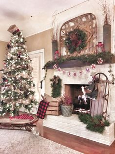 a living room decorated for christmas with a tree, fireplace mantel and rocking chair