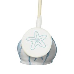 a blue and white toothbrush holder with a starfish on it