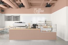 the interior of a coffee shop with pink walls