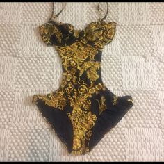 Gold And Black Monokini. New With Tags Never Been Worn. Runs Small. Lowballs Will Not Be Accepted If It’s Listed It’s Available No Modeling/Holds Gold Summer Evening Swimwear, Gold Evening Swimwear For Summer, Luxury Black One-piece Swimwear, Luxury Gold Swimwear For Party, Luxury Fitted Swimwear For Summer, Luxury Fitted Beach Swimwear, Glamorous Fitted Swimwear For Pool, Elegant Gold Stretch Swimwear, Luxury Fitted Black Swimwear