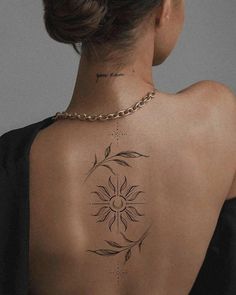 a woman with a tattoo on her back