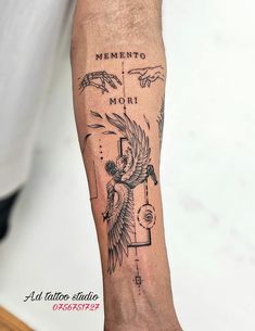 a man with a tattoo on his arm that says mento mori and an eagle