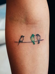 three birds sitting on a wire tattoo