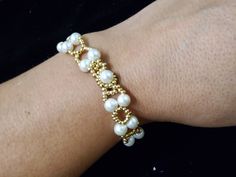 An elastic white beads bracelete White Pearl Stretch Bracelet For Party, Elegant White Beaded Stretch Bracelet, White Pearl Stretch Bracelet With Spacer Beads, Handmade Elegant Pearl Stretch Bracelet, Elegant Handmade Pearl Stretch Bracelet, Elastic Bracelet, White Beads, Jewelry Bracelets, Beaded Bracelets