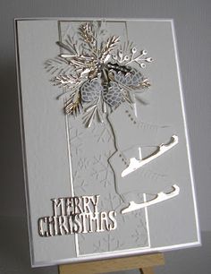 a white christmas card on a easel