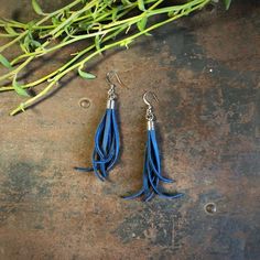 -These tassel earrings are made from soft cadet-blue deerskin leather.  Part Western, part Boho, part Rock 'n Roll, these little fringe earrings give a big kick to any outfit.-Lightweight enough to wear every day. -3" - 3.5" total length, including earwires.-Earwires are silver-color.-Deerskin leather is sustainably sourced in the USA.-Ok to get wet.-Available in 13 colors.-Designed and handmade in South Pasadena, CA.Check out more of our awesome earrings here:https://www.etsy.com/shop/ASTALIJew Blue Leather Bohemian Earrings, Blue Bohemian Leather Earrings, Bohemian Blue Leather Earrings, Bullet Shell Jewelry, Leather Tassel Earrings, Awesome Earrings, Black Statement Earrings, Repurposed Necklace, Bullet Shell