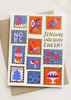 a card with stamps on it that says sending holiday cheer